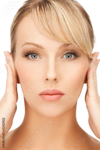 Photo: woman holding hands on her face woman holding hands on her face