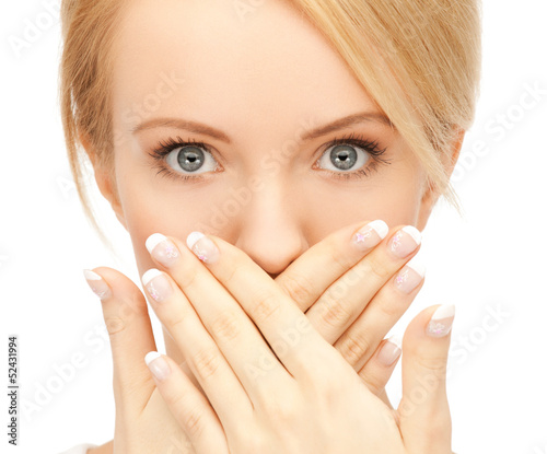 Photo: amazed woman with hand over mouth amazed woman with hand over mouth