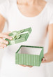 Foto: woman hands with gift box woman hands with gift box