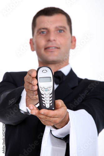 Photo: Waiter showing phone Waiter showing phone