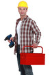 Foto: Worker holding drill Worker holding drill