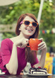 Style redhead girl with cake and cup