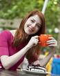 Style redhead girl with cake and cup