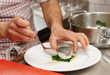 Chef is serving boiled seabass