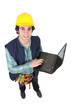 Tradesman holding a laptop