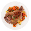 Tasty ribeye steak with stir fried vegetables isolated on white
