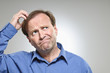 Mature Caucasian Man Scratching Head