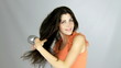 Happy woman drying long hair