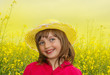 little girl on a rapeseed field