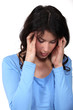 Photo: woman having a headache woman having a headache