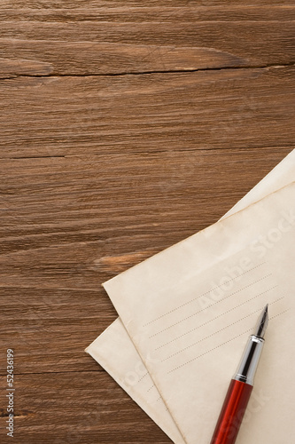 Photo: ink pen and old postal envelope ink pen and old postal envelope