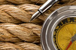 compass with pen on ship ropes