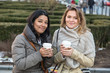 Two Young Women with Hot Beverage