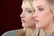Sad woman looking in the mirror