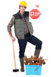 Builder with box of materials to be recycled