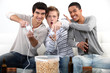 Teenagers playing video games.