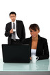 Photo: Colleagues drinking coffee whilst working Colleagues drinking coffee whilst working