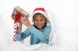 Young boy holding his Christmas present.
