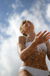 Attractive woman splashing in the water