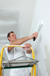 Photo: Man redecorating his house Man redecorating his house