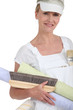 Woman preparing to wallpaper