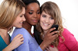 Girlfriends with a mobile phone