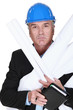 Senior architect holding plans and agenda