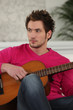 young boy playing the guitar