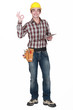 Builder holding clip-board making OK gesture