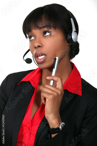 Photo: Woman daydreaming at work Woman daydreaming at work