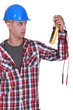 Photo: Electrician holding multimeter Electrician holding multimeter