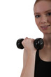 Photo: Woman lifting free weights Woman lifting free weights