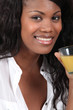woman drinking orange juice