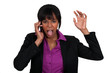Foto: Businesswoman furious over the phone. Businesswoman furious over the phone.