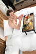 Photo: Man having breakfast in bed Man having breakfast in bed