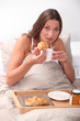 Woman having breakfast in bed