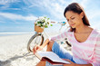 beach bicycle woman reading book