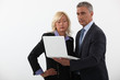 Photo: Businesspeople reading a report Businesspeople reading a report