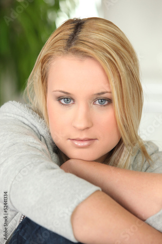 Photo: Portrait of an attractive casually dressed young woman Portrait of an attractive casually dressed young woman