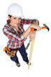 Woman carpenter, studio shot