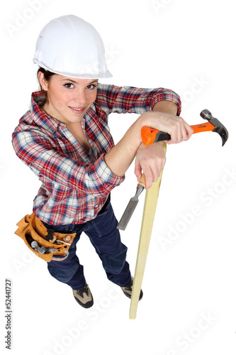 Photo: Woman carpenter, studio shot Woman carpenter, studio shot