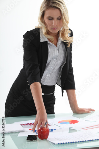 Photo: businesswoman analyzing statistics businesswoman analyzing statistics