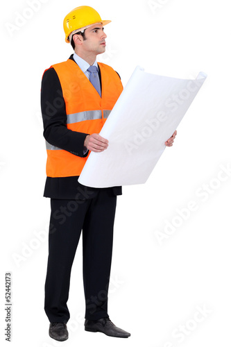 Photo: Engineer verifying a drawing Engineer verifying a drawing