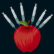 Red apple and syringes on a black background