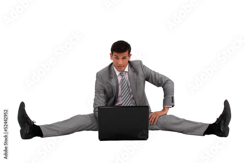 Photo: businessman side splitting on the floor businessman side splitting on the floor