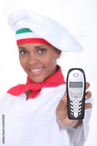 Photo: pizzaiola showing a phone pizzaiola showing a phone