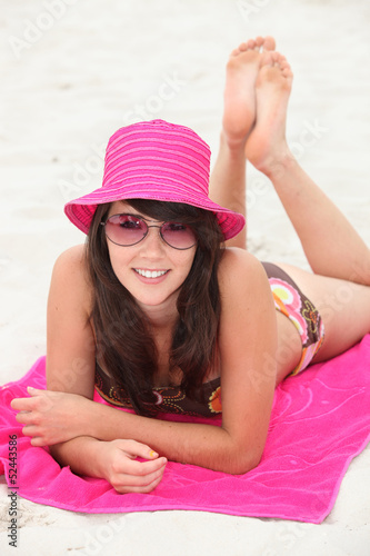 Photo: Teenager lying on the beach Teenager lying on the beach