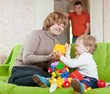 Photo: Family plays with toys in home Family plays with toys in home