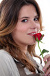 Foto: Woman stood with rose Woman stood with rose