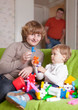 Photo: mother and child plays with toys mother and child plays with toys